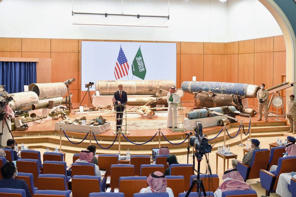 US Special Representative for Iran Brian Hook (left) and Saudi Minister of State for Foreign Affairs Abdel al-Jubeir hold a press conference in Riyadh on 29 June. The 106 mm recoilless rifle rounds that may have been supplied to AQAP and the MANPADS recovered from the Houthis can be seen on the left side of the weapons display.      (Saudi Press Agency)