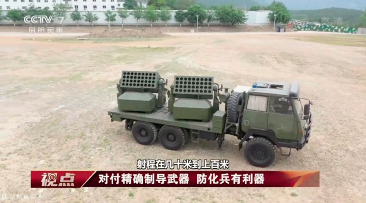 A screengrab from CCTV-7 footage showing a new Chinese truck-mounted countermeasures system capable of launching rockets deploying obscurants and decoys.