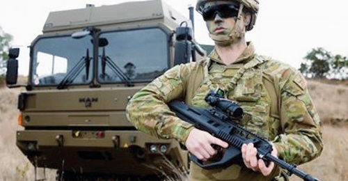 An Australian soldier carrying an EF88 Austeyr 5.56 mm rifle. Canberra announced on 13 July that it will procure 8,500 additional units of this weapon for the ADF.