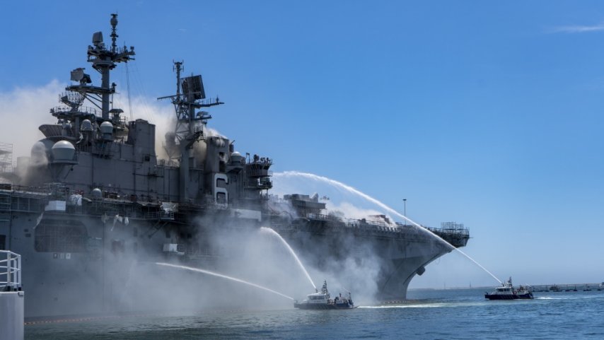 
        Port of San Diego Harbor Police Department boats combat a fire on board USS 
        Bonhomme Richard
         (LHD 6) at Naval Base San Diego on 12 July.
       (Credit: US Navy)
