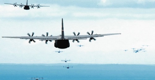 A formation of US Air Force C-130Js fly towards a drop zone during an exercise. Lockheed Martin has been awarded USD15 billion to cover work through to 2030, which follows an earlier 2016 award for USD10 billion to cover production through to 2016.