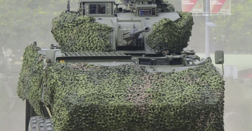 A Portuguese Pandur II IFV is shown with an SP30 two-man turret armed with a 30 mm MK30-2 cannon and two 7.62 mm MAG58 weapons.