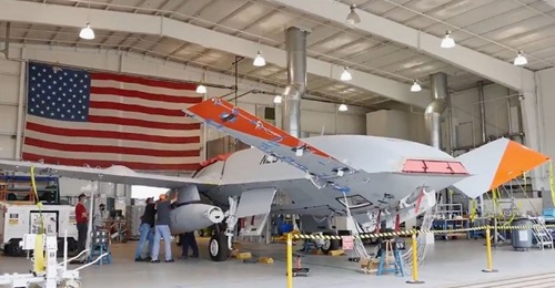 Screen capture of the underwing refuelling pod being mounted on T1.