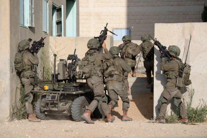 Soldiers from the Multi-Dimensional Unit practice storming a building with an unmanned ground vehicle. (Israel Defense Forces)