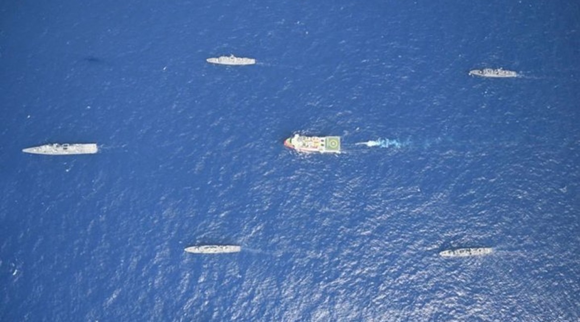 Turkey's research vessel 
        
          being escorted by Turkish warships.