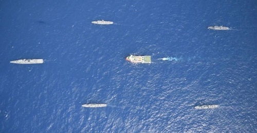 Turkey's research vessel 
        
          being escorted by Turkish warships.
