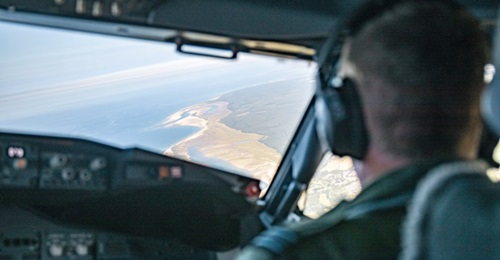 The view from the cockpit of an RAF P-8 flying a mission over the English Channel to monitor migrants.