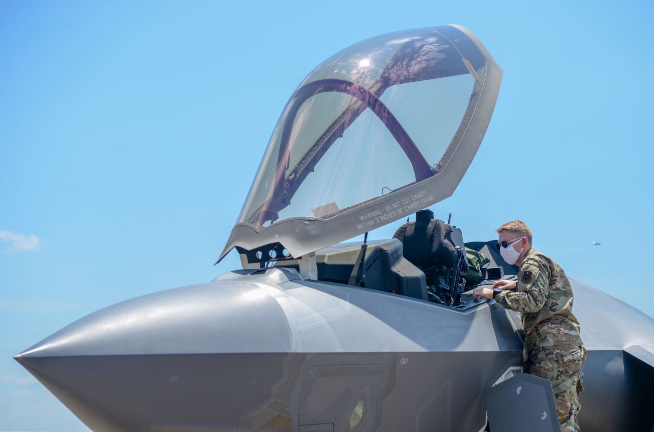 A member of the Columbus Air Force Base Fire Department inspects the interior of an F-35A on 7 August 2020 at Columbus AFB in Mississippi. The Pentagon potentially overpaid USD10.6 million in performance-incentive fees by not independently collecting and verifying F-35 aircraft availability hours. (US Air Force)