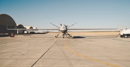 A General Atomics MQ-9B Reaper unmanned aerial vehicle staged at the US Army Yuma Proving Grounds on 7 November 2019. USMC engineers are developing a Fused Integrated Naval Network (FINN) pod prototype to be integrated on to the MQ-9B.