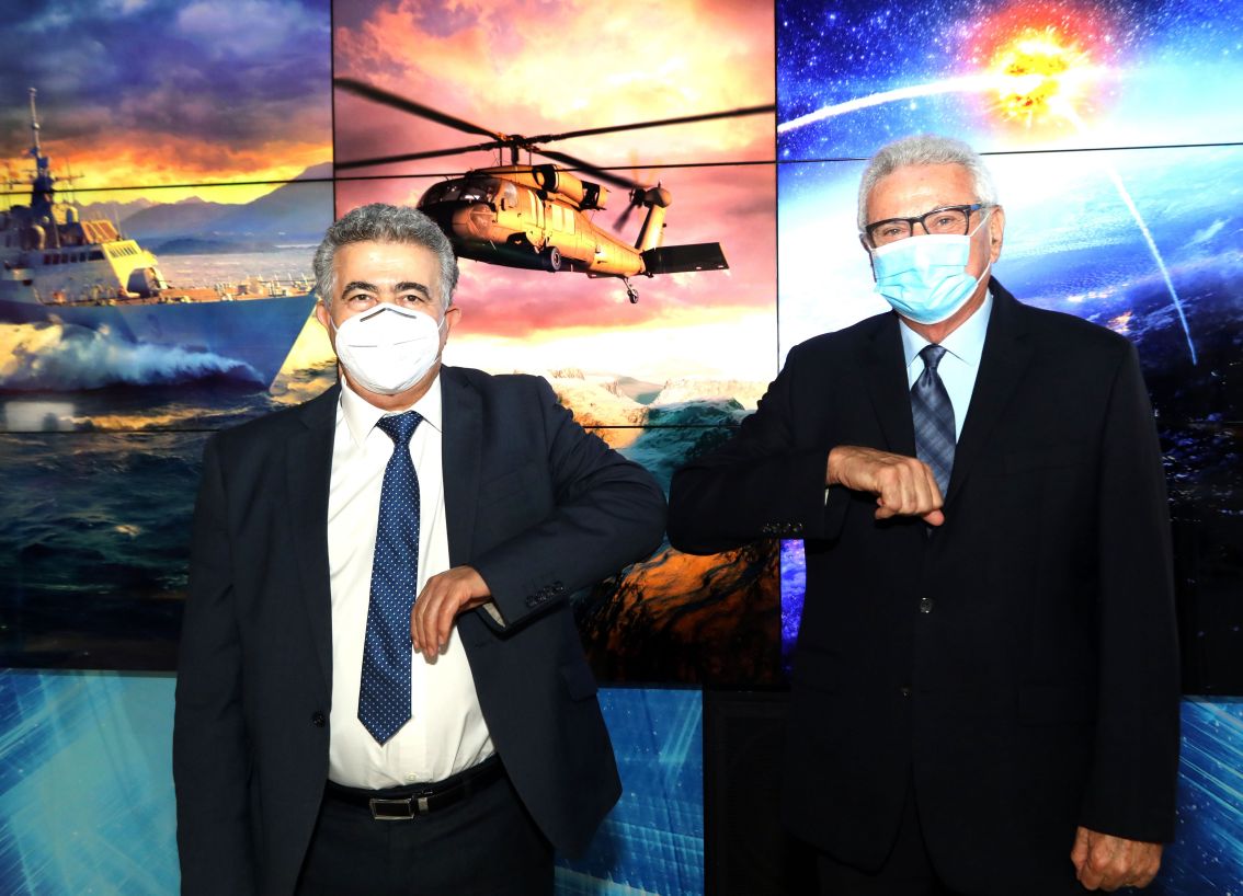 Amir Peretz, Israel’s Minister of Economy and Industry (left) and Joshua (Shiki) Shani, Chief Executive of Lockheed Martin Israel (right) at the signing of an umbrella agreement between Lockheed Martin and the Israeli government for industrial co-operation. (Lockheed Martin/Sivan Firag)
