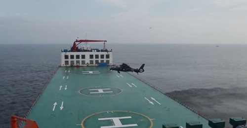 A screengrab from CCTV 7 footage released on 19 August showing a PLAGF Z-19 helicopter about to land on a commercial semi-submersible ship as part of an exercise.