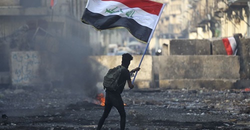 An anti-government protester in the Iraqi capital Baghdad in November 2019.