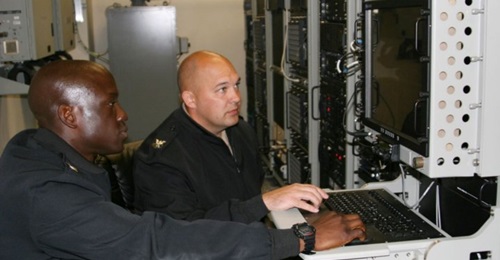 US Navy Cryptologic Technician (Collection) First Class Irving Juleus and Cryptologic Technician (Collection) First Class Terrance Krueger use a collections suite during a training operation on 6 April 2016 in San Diego, Calif. Navy leaders plan to tra...