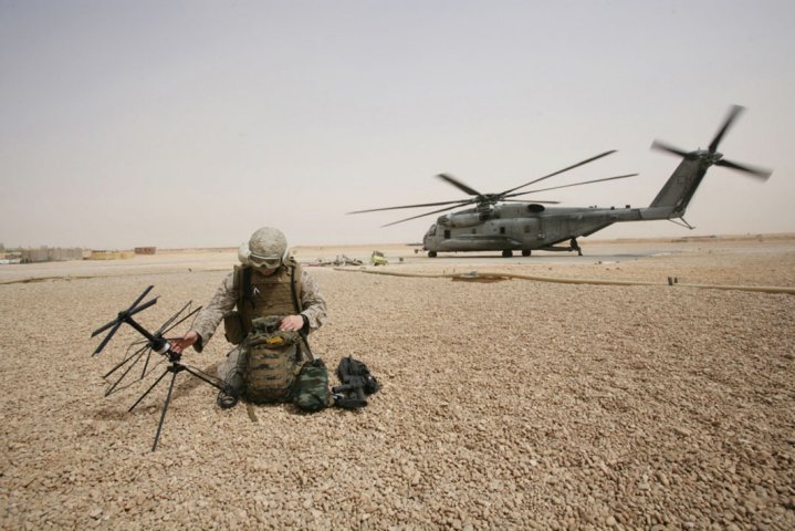 A US Marine Corps field radio operator from the 26th Marine Expeditionary Unit sets up satellite communication at Camp Korean Village, Iraq in 2008. The Pentagon’s Space Development Agency awarded contracts for the National Defense Space Architecture’s inaugural Transport Layer tranche, designed to provide regional satellite-based tactical datalink connectivity to US armed forces. (US Department of Defense )
