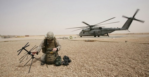 A US Marine Corps field radio operator from the 26th Marine Expeditionary Unit sets up satellite communication at Camp Korean Village, Iraq in 2008. The Pentagon's Space Development Agency awarded contracts for the National Defense Space Architecture's...