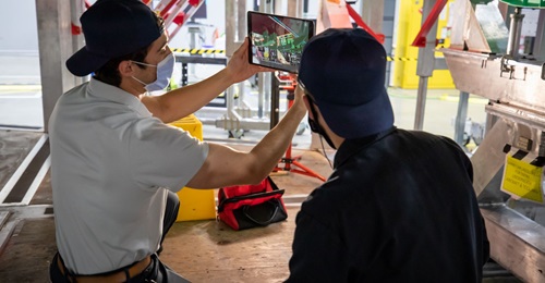 Two employees leverage augmented reality and 3D work instructions to build an air vehicle. While not demonstrative of the full scope of a digital thread (such as connecting engineering, manufacturing, and the supply chain in one virtual environment for...