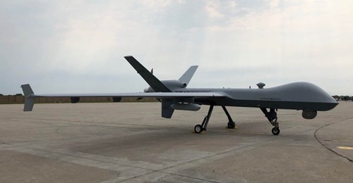 A US Air Force MQ-9 Reaper UAS, equipped with Air Force Research Laboratory's Agile Condor high-power computing pod, sits on the runway of General Atomics' Flight Test and Training Center in Grand Forks, North Dakota. The Pentagon's Joint Artificial In...