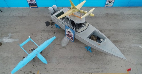 An Ababil-3 is seen next to a fast attack craft with an Ababil-2 mounted on its roof where a multiple-rocket launcher is normally fitted. The boat is around 11 m long.