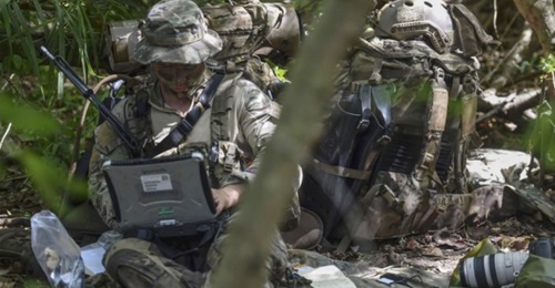 A US Air Force Special Operations Weather Technician sends intelligence during a 31 October 2017 field exercise. Pentagon officials are seeking new spectrum bandwidth solutions for 5G communications on civilian and military mobile networks.