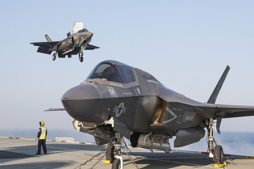 
        A US F-35B about to be joined by a UK aircraft on the deck of HMS 
        Queen Elizabeth
        . Besides these two nations and Italy, other potential operators have expressed interest in the ‘pocket carrier’ capability that the STOVL jet could afford them. To this end, Lockheed Martin is to perform a series of ‘unique sea trials’ of the F-35 for non-DoD participants of the wider programme.
       (Crown Copyright)