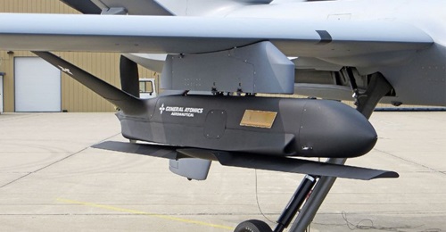 The Sparrowhawk demonstrator seen mounted on a MQ-9A Reaper UAV with its main wing folded for carriage.