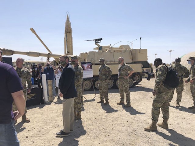 US Army Secretary Ryan McCarthy and Army Chief of Staff Gen James McConville receive a briefing after the Project Convergence 2020 capstone event on 23 September. During the event, the army fired the ERCA prototype. (Janes/Ashley Roque)