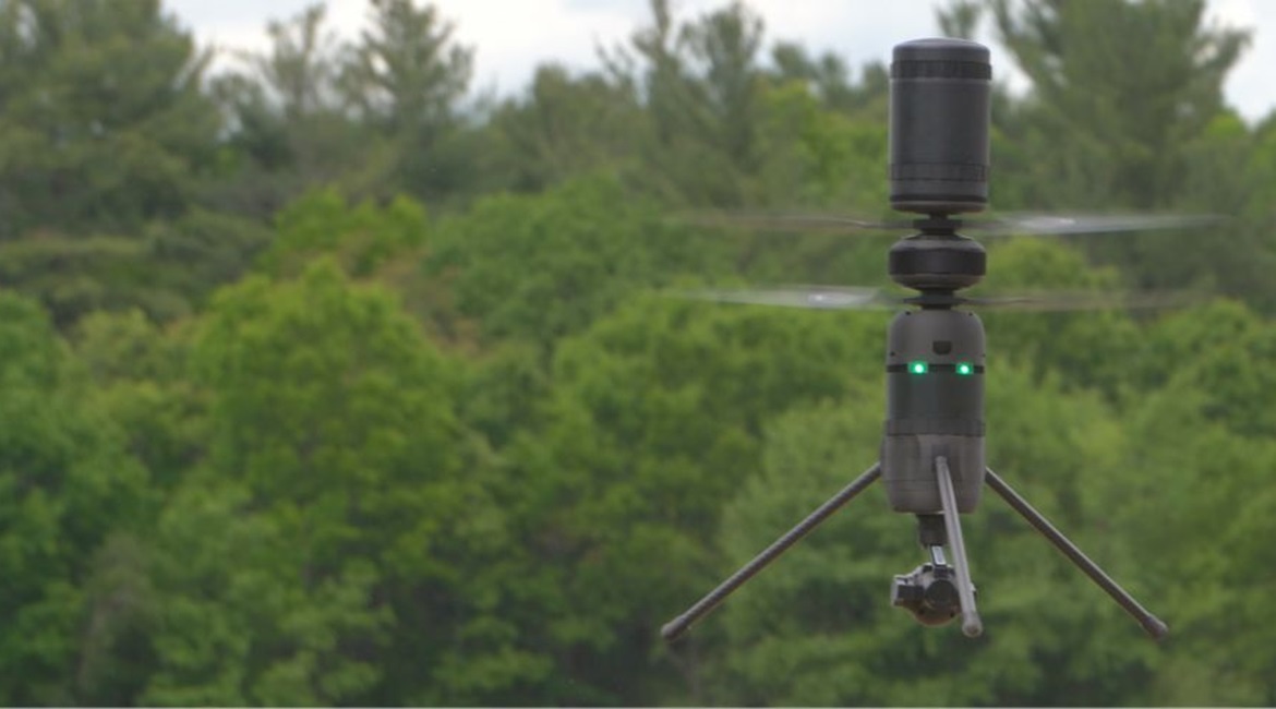 Ascent Aerosystems' Spirit cylindrical coaxial rotor small unmanned aerial system (sUAS). The aircraft is about 28 cm tall and roughly 11 cm in diameter.