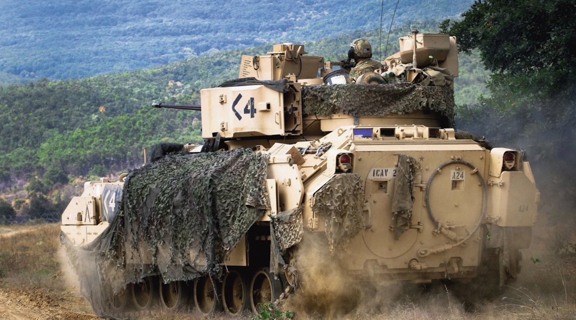 US Army Sergeant Ansel Frayer, sitting in the gunner's turret, and his crew manoeuvre their M2A3 Bradley during a live-fire exercise in Bulgaria in August 2018. The service has plans to buy IFLD APSs for its Bradley fleet but does not currently have th...