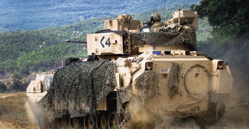 US Army Sergeant Ansel Frayer, sitting in the gunner's turret, and his crew manoeuvre their M2A3 Bradley during a live-fire exercise in Bulgaria in August 2018. The service has plans to buy IFLD APSs for its Bradley fleet but does not currently have th...