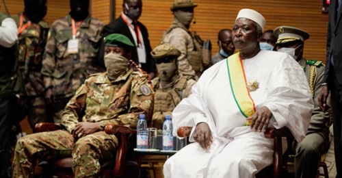 Malian transitional President Bah N'daou, right, with Malian interim vice-president Colonel Assimi Goïta, left, during an inauguration ceremony at the CICB (Centre International de Conferences de Bamako) in Bamako on 25 September 2020. A mixed civ...
