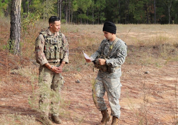 Sergeant First Class Jeremiah Velez, left, an advisor with 3rd Squadron, 1st SFAB, works with a simulated foreign partner during a field training exercise in October 2019 at Fort Benning, Georgia. Soldiers later deployed to Colombia.  (US Army )