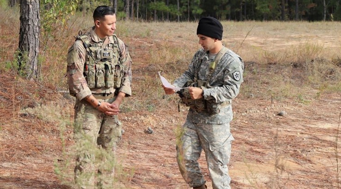 Sergeant First Class Jeremiah Velez, left, an advisor with 3rd Squadron, 1st SFAB, works with a simulated foreign partner during a field training exercise in October 2019 at Fort Benning, Georgia. Soldiers later deployed to Colombia.