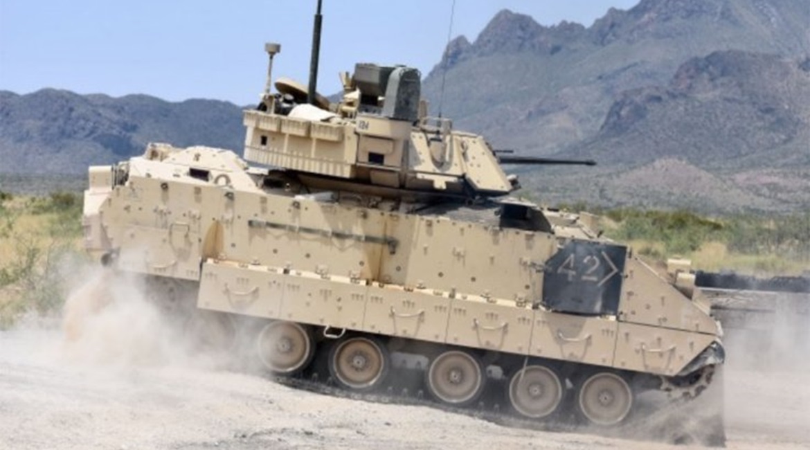 An M2A3 Bradley Fighting Vehicle crew changes position on the range during a gunnery training event in 2018. The US Army plans to issue a final RFP for its revamped Bradley replacement effort in December.