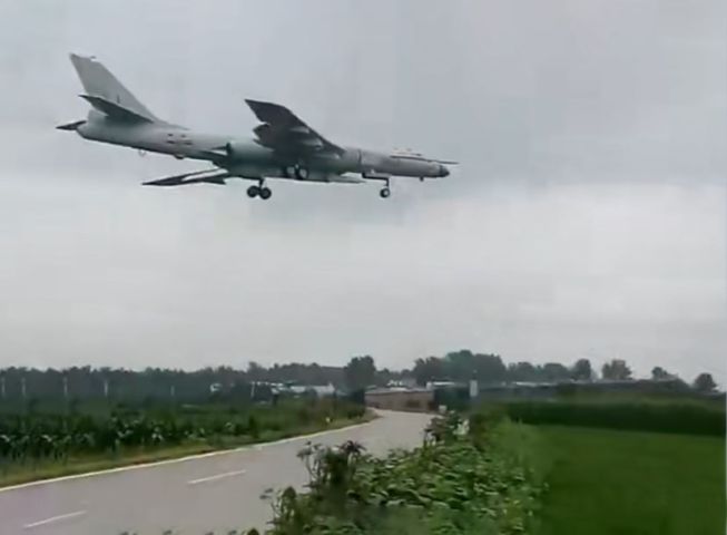 A screengrab from video footage posted on Weibo on 17 October showing a PLAAF H-6N carrying a large missile under its fuselage.  (Via haohanfw.com)
