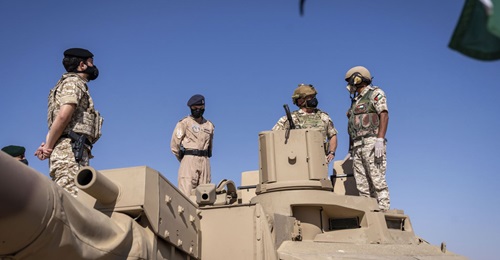 King Abdullah II (centre with helmet), Prince Hussein (left), and Princess Salma (between the two) inspect a Leclerc tank during Exercise 'Salah al-Din Fortress'.