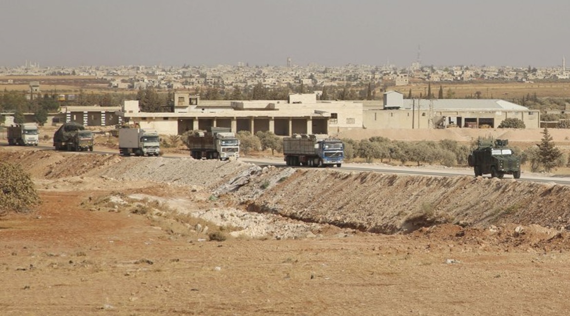 The convoy from the evacuated Turkish outpost east of Morek arrives in rebel-held territory near Al-Nayrab on 20 October.