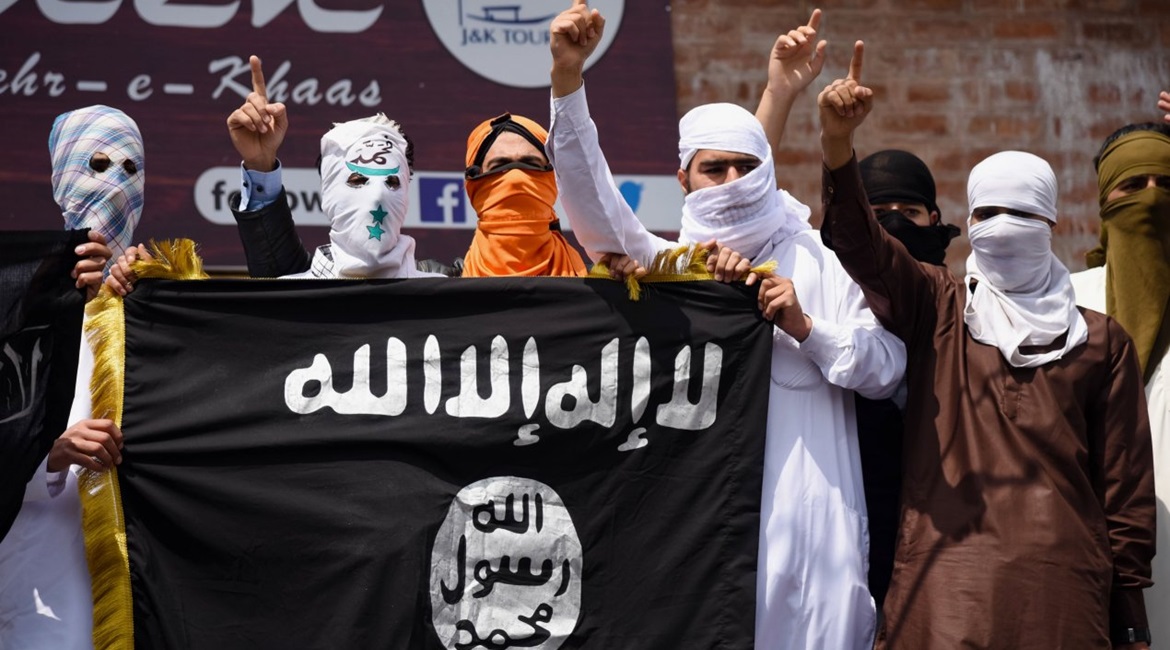Kashmiri protesters hold up an Islamic State flag in Srinagar in India's Jammu and Kashmir state on 5 June 2019. Wilayat Pakistan sources claimed that their group and Wilayat al-Hind were actively recruiting in the region.