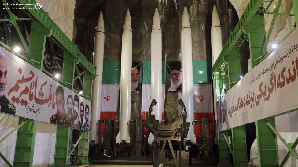 A still from the video shows five Emad ballistic missiles loaded on to the rail launcher in an underground facility, with the erector in the foreground. (IMA Media)