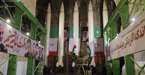 A still from the video shows five Emad ballistic missiles loaded on to the rail launcher in an underground facility, with the erector in the foreground.