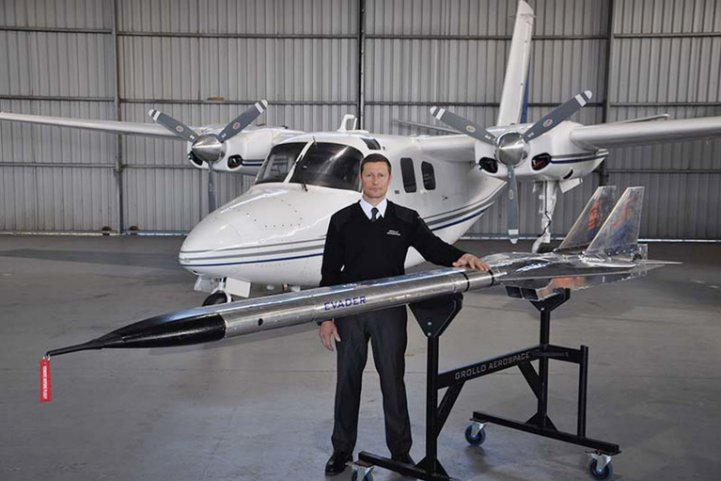 The Australian-developed Evader autonomous aerial target missile system (foreground) and the Aero Commander 500-series aircraft used to test-fire it. (Grollo Aerospace )