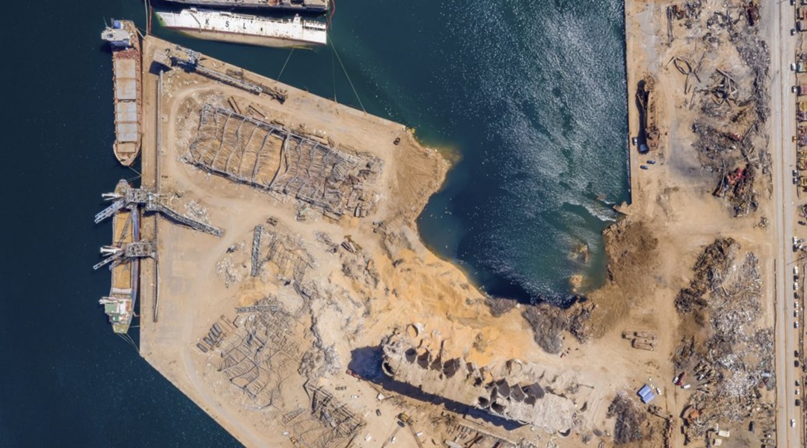An aerial view, taken on 21 August 2020, of the aftermath of the Beirut port explosion on 4 August, showing the crater that occupies the space of the warehouse where the initial fire broke out and the ammonium nitrate was stored.
