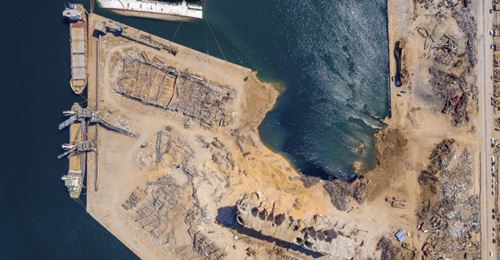 An aerial view, taken on 21 August 2020, of the aftermath of the Beirut port explosion on 4 August, showing the crater that occupies the space of the warehouse where the initial fire broke out and the ammonium nitrate was stored.