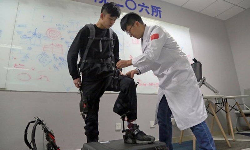 CASIC’s recently developed unpowered exoskeleton system is shown here being prepared for a demonstration. (CASIC via Weibo)