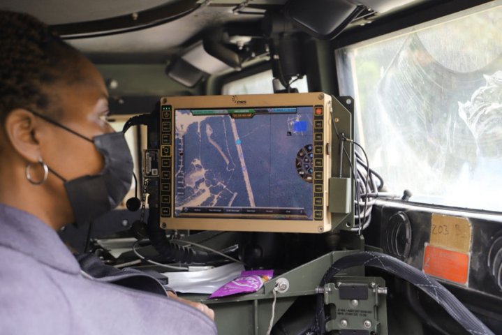 A C5ISR Center electronics engineer studies vehicle positions during Network Modernization Experiment 20 at Joint Base McGuire-Dix-Lakehurst, New Jersey. (US Department of Defense )