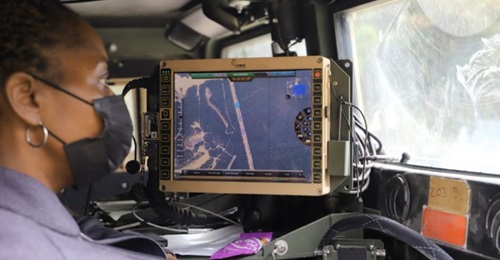 A C5ISR Center electronics engineer studies vehicle positions during Network Modernization Experiment 20 at Joint Base McGuire-Dix-Lakehurst, New Jersey.
