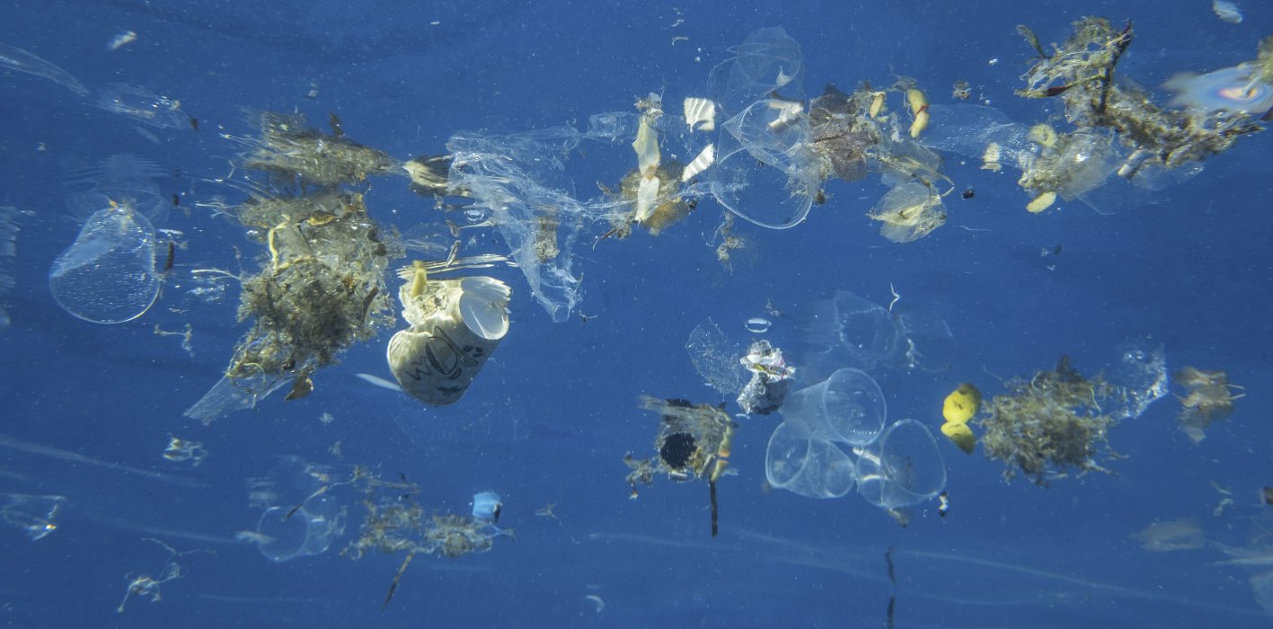 Plastic waste and other debris floats underwater in the Red Sea at Sharm El Sheikh, Egypt, in October 2020. Global awareness about the effects of plastic pollution will continue to drive greater efforts to recycle plastic waste, in turn providing entry points for organised crime gangs to move into the lucrative trade. (Andrey Nekrasov/Barcroft Media via Getty Images)