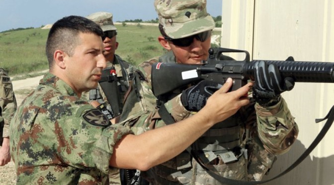 A Serbian military operations in urban terrain (MOUT) instructor trains members of the Ohio National Guard's 838th Military Police Company on 12 June 2019 during peacekeeping exercise 'Platinum Wolf 2019' at South Base, Serbia.