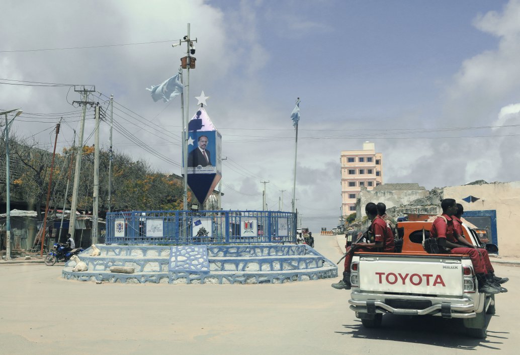 Banners of Somalian President Mohamed Abdullahi Mohamed, widely known as Farmaajo, overlook a crossroads in Mogadishu, Somalia, on 3 August 2020. The violence and instability that started with Somalia’s civil war in 1991 continue to characterise the country’s efforts to reform politically and in its security response to insurgency. (Lokman Ilhan/Anadolu Agency via Getty Images)