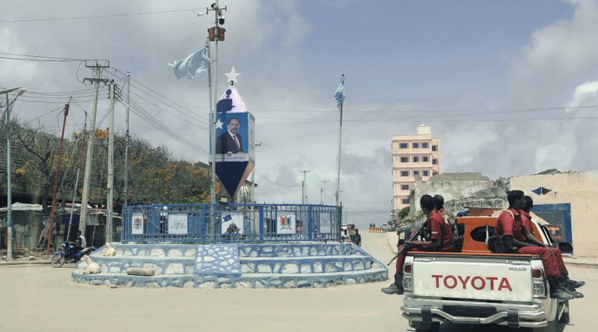 Banners of Somalian President Mohamed Abdullahi Mohamed, widely known as Farmaajo, overlook a crossroads in Mogadishu, Somalia, on 3 August 2020. The violence and instability that started with Somalia's civil war in 1991 continue to characterise the co...