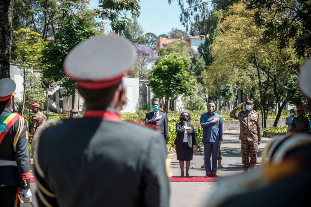 Sahle-Work Zewde (centre L), President of Ethiopia, stands next to Abiy Ahmed (centre R), Prime Minister of Ethiopia, and General Birhanu Jula (R), Chief of General Staff, during an event to honour the national defence forces in the capital Addis Ababa, on 17 November 2020. (Eduardo Soteras/AFP via Getty Images)